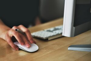 Person using a mouse and keyboard