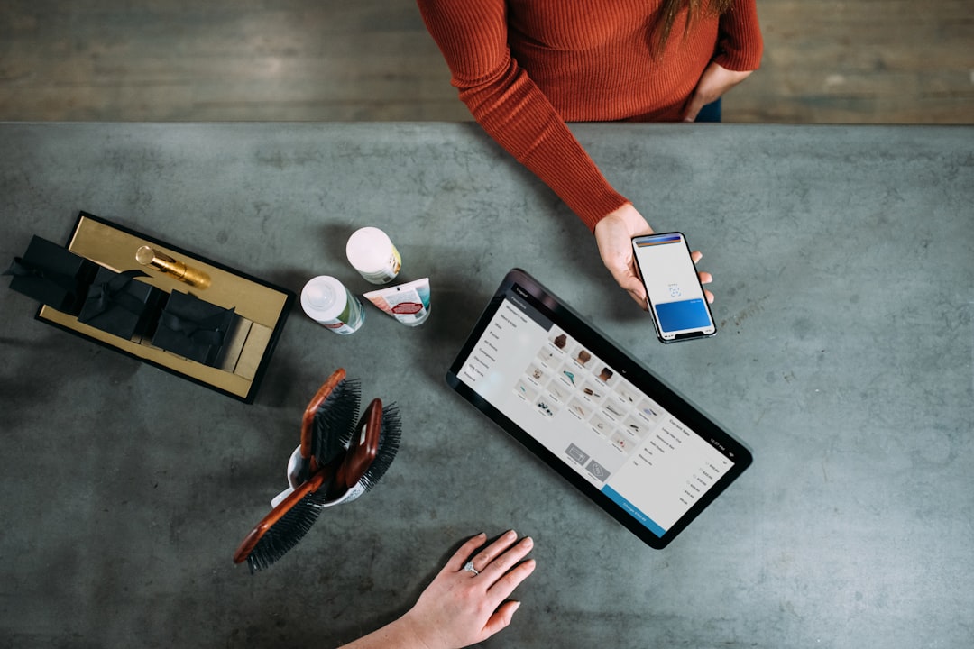 Growth Rocket person holding smartphone beside tablet computer