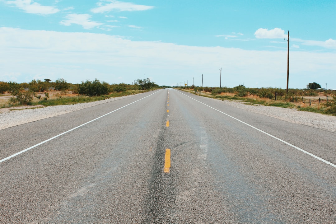Growth Rocket a road with a line of yellow lines on it