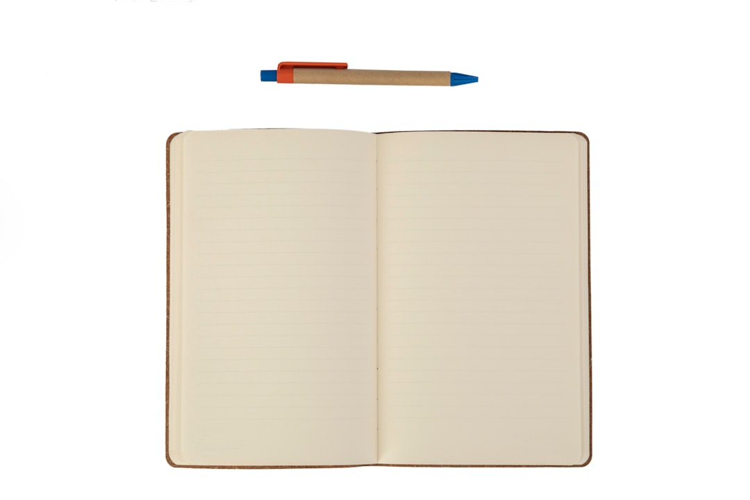 Growth Rocket white book with blue pen