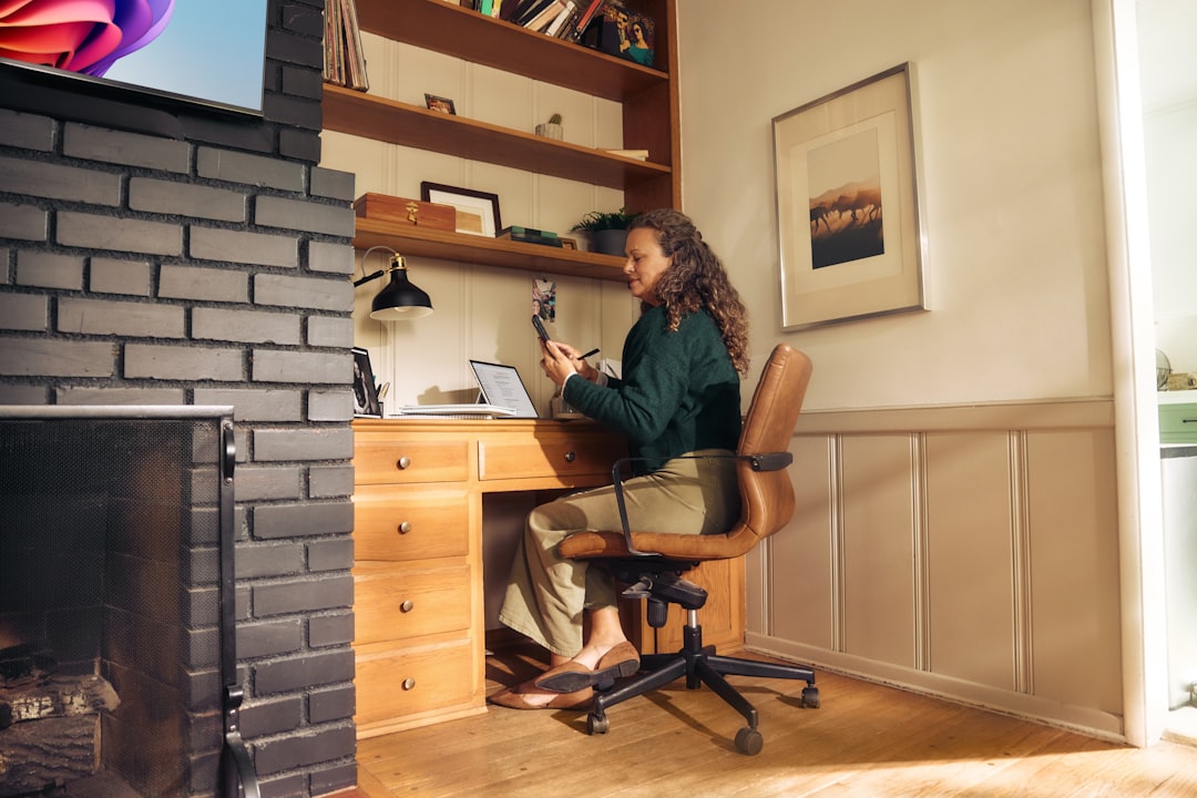 Growth Rocket Woman working at a desk in a cozy home office.