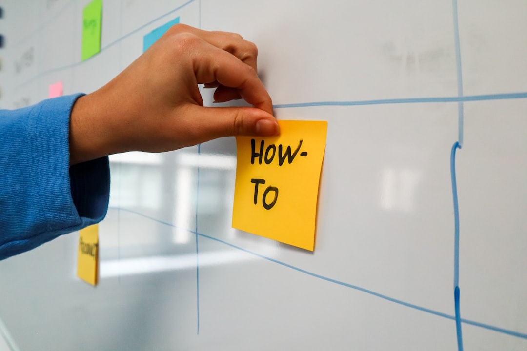 Growth Rocket a sticky note pinned to a wall with the words how to written on it