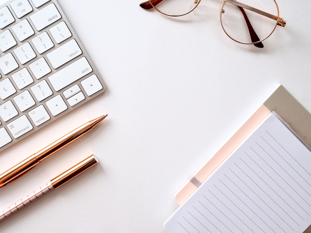Growth Rocket pen near black lined paper and eyeglasses