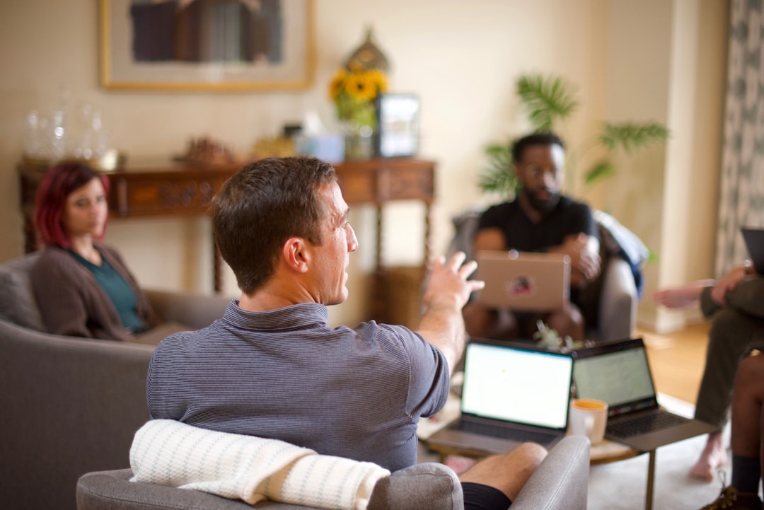 Growth Rocket man in gray sweater sitting on couch