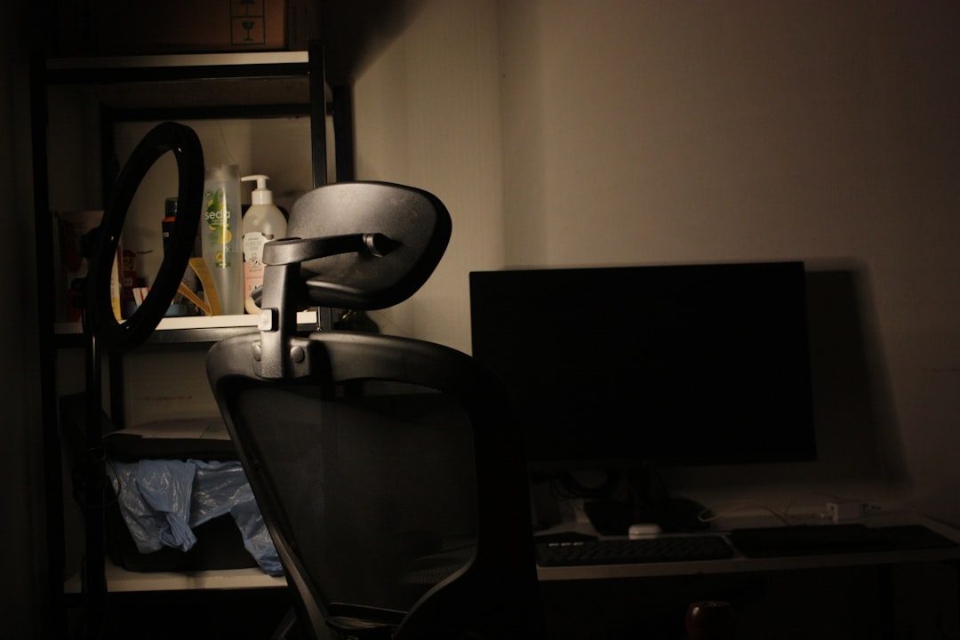 Growth Rocket Desk with chair and computer in dim lighting