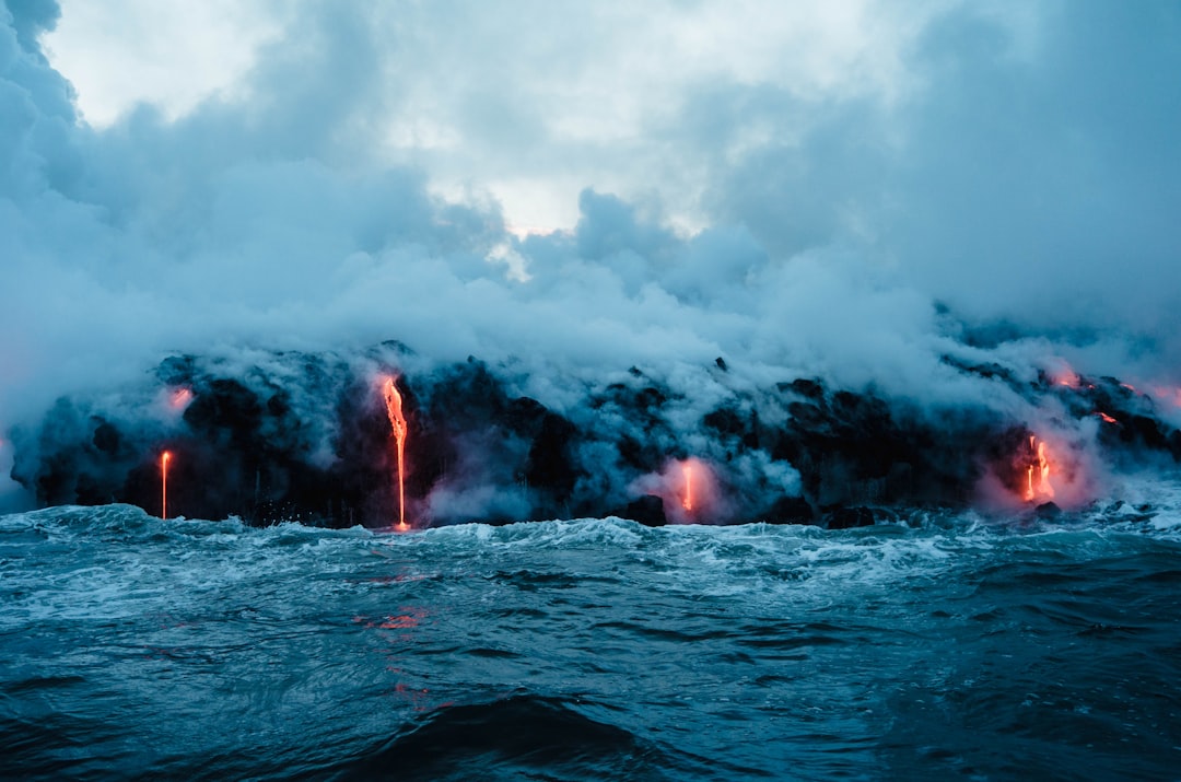Growth Rocket Molten lava flowing into the ocean at Kalapana, creating thick clouds of steam