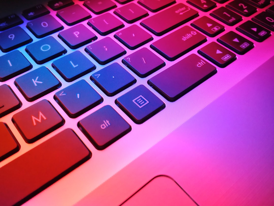 Growth Rocket a close up of a laptop keyboard with red and blue keys